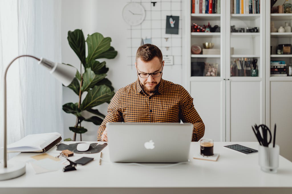 man working on laptop in office