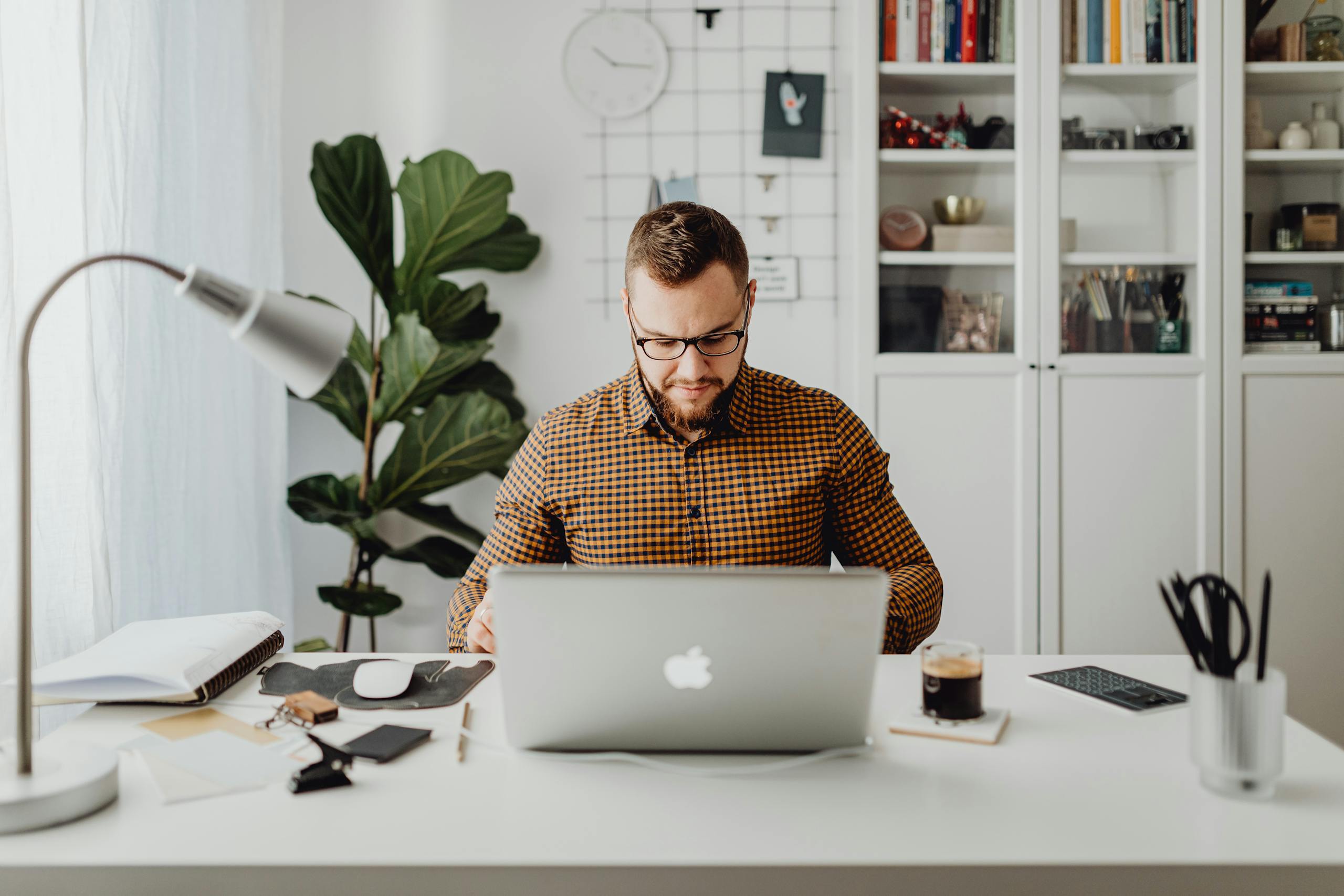 man working on laptop in office